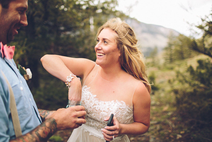 bride pulling note out of jar