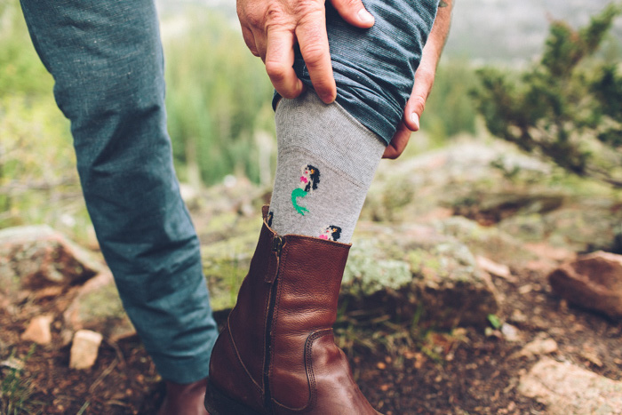 groom showing off mermaid socks