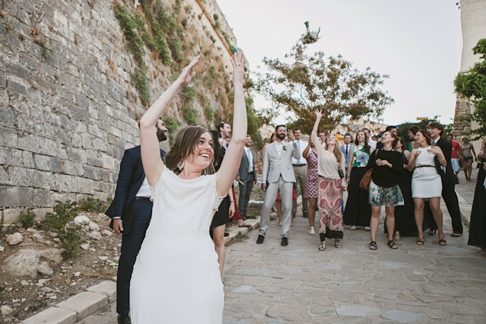 bride tossing bouquet