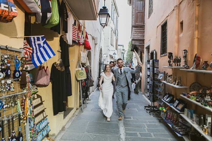 bride and groom walking through Crete streets