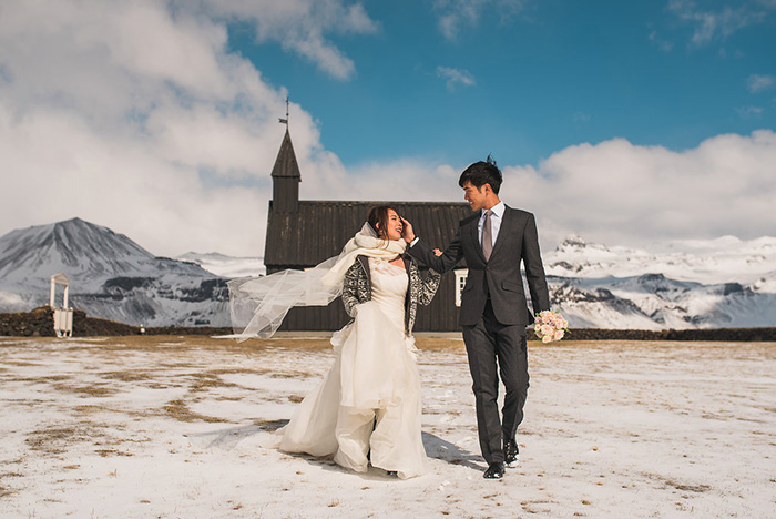 bride and groom leaving iceland chapel