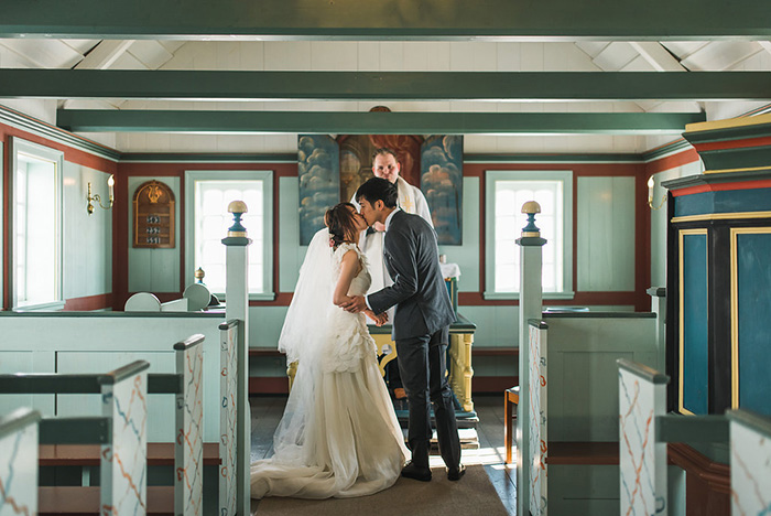 bride and groom first kiss