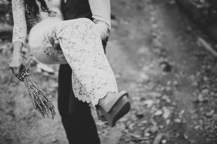 groom carrying bride