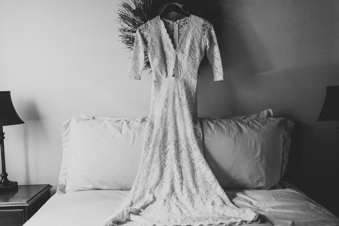 wedding dress hangingover bed