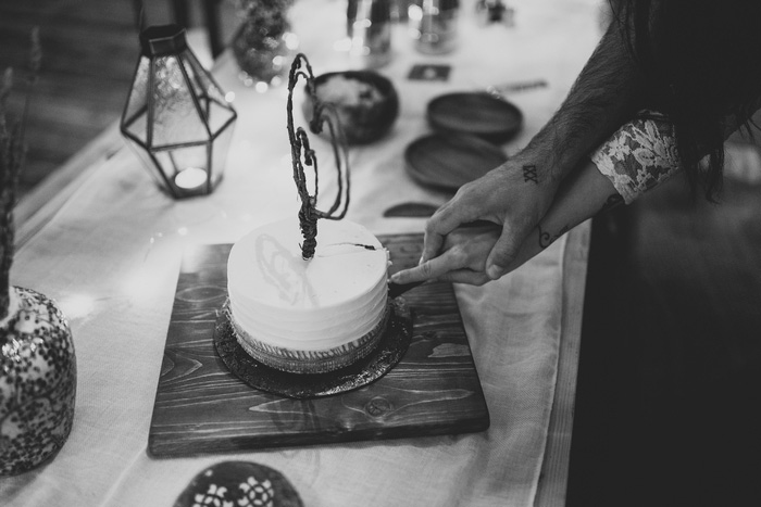 bride and groom cutting cake