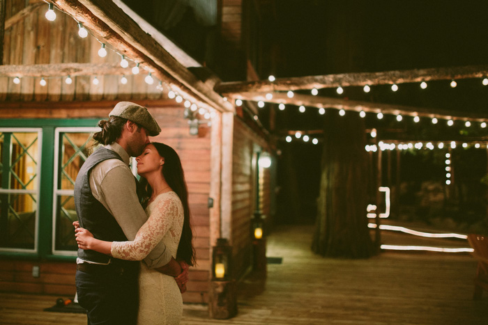 bride and groom dancing on cabin patio