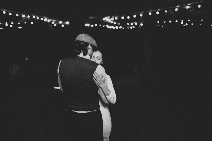 bride and groom dancing on cabin patio