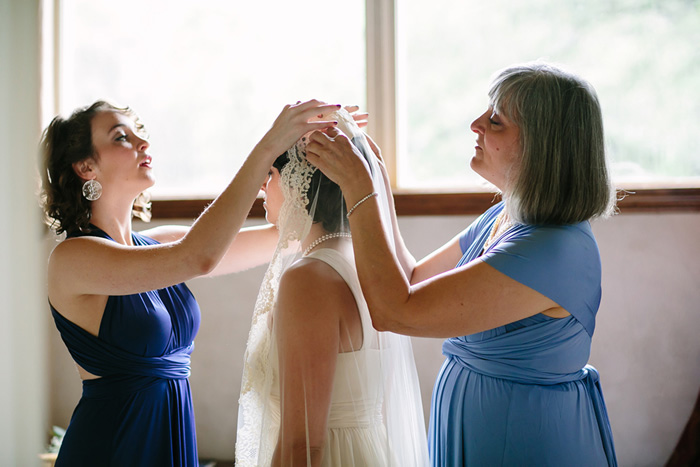 bride having veil put on