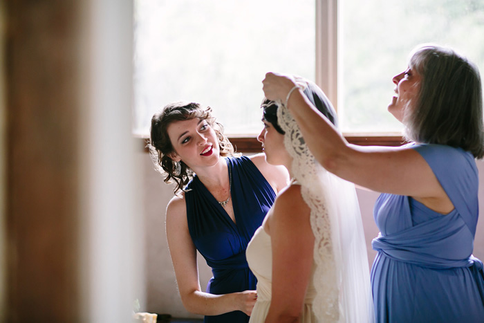 bride having her veil put on