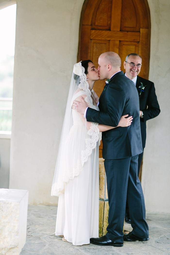 bride and groom first kiss