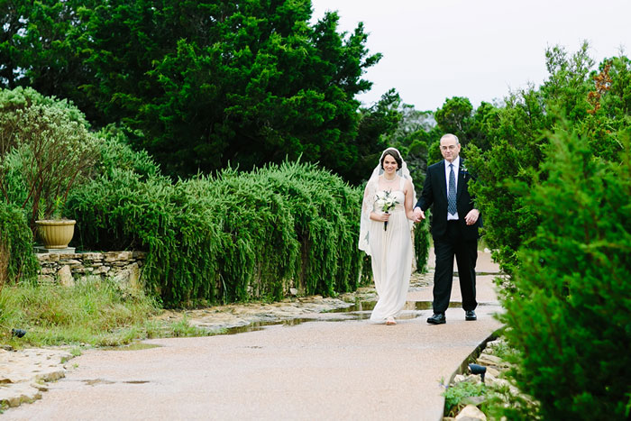 bride walking to chapel with her father