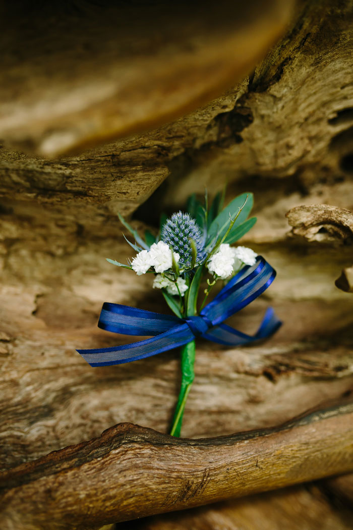 boutonniere on driftwood