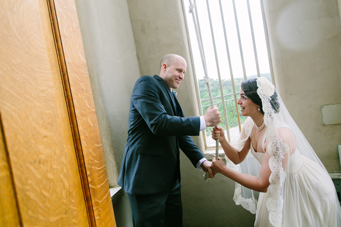 bride and groom ringing church bell