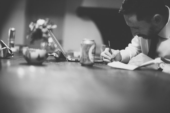 groom writing vows