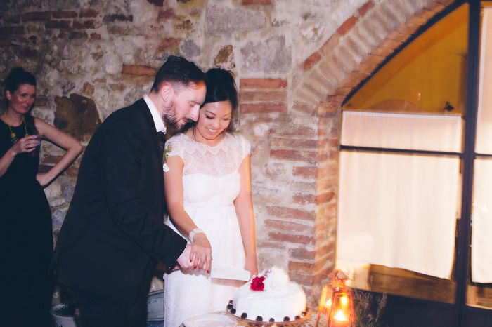 bride and groom cutting cake