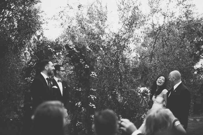 bride laughing at the altar