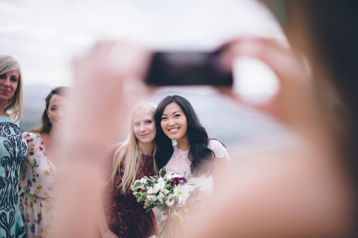 bride having her photo taken with guests