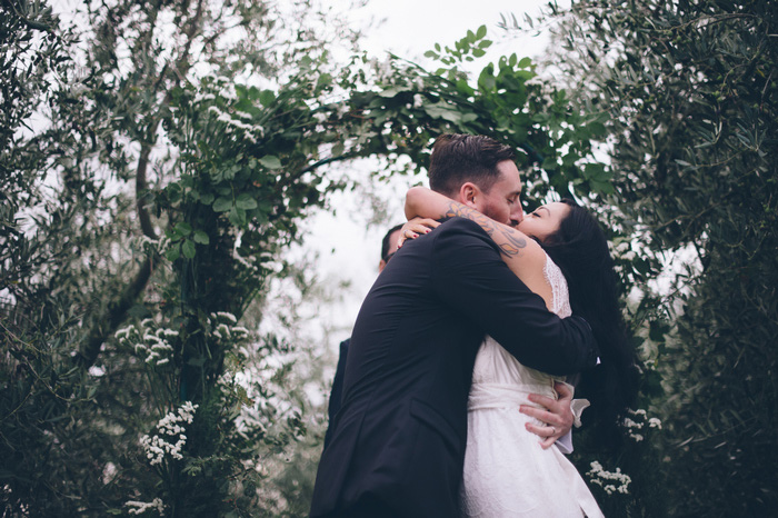 bride and groom first kiss