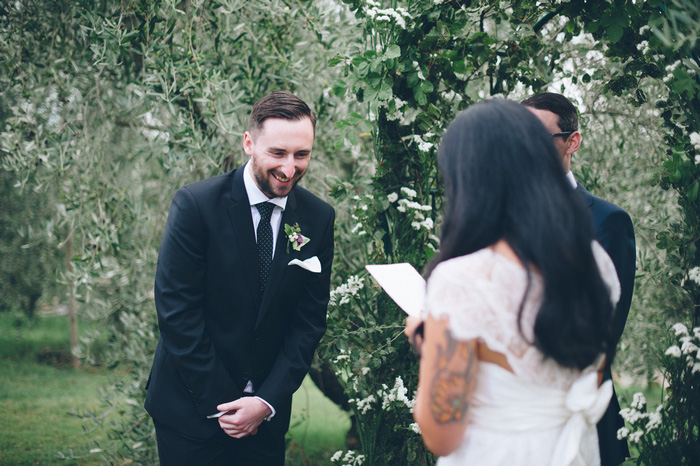 groom laughing during ceremony