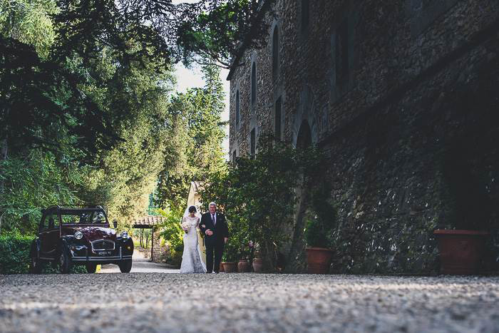 bride walking to ceremony with her father