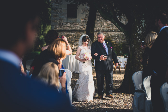 bride walking down the aisle with her father