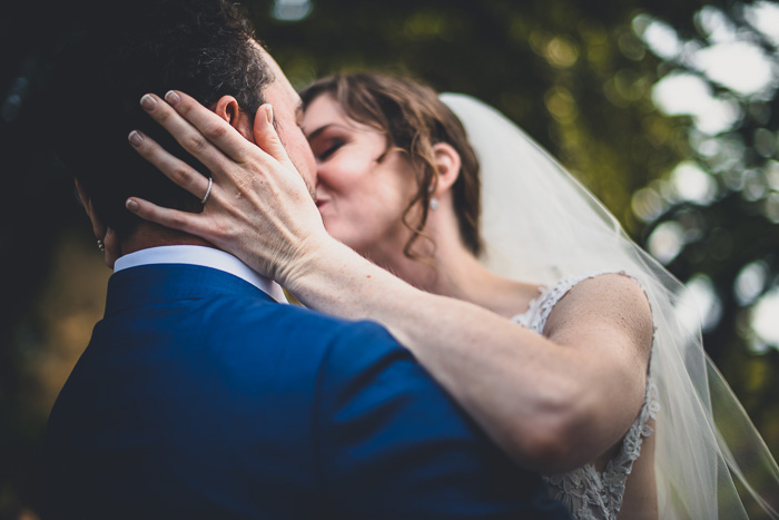 bride and groom first kiss