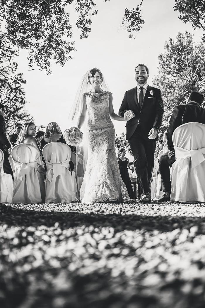 bride and groom walking up aisle