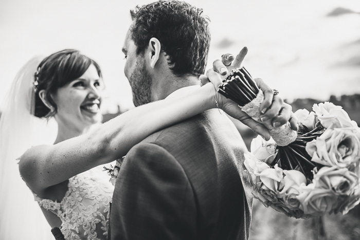 bride and groom embracing