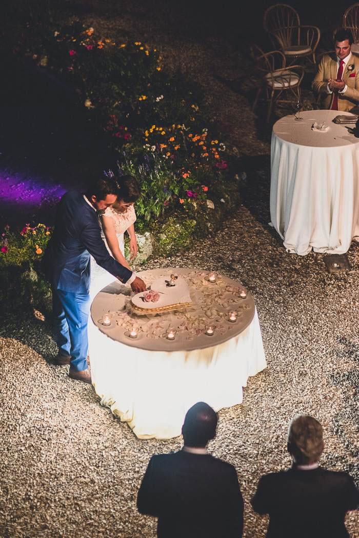 bride and groom cutting cake