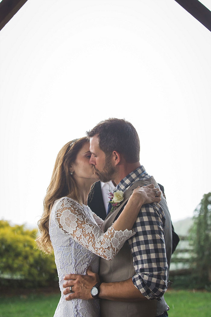 bride and groom first kiss