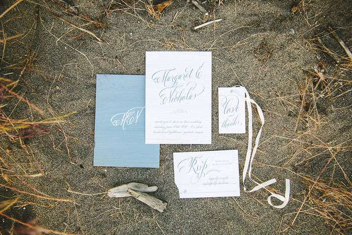 wedding invitation suite in the sand