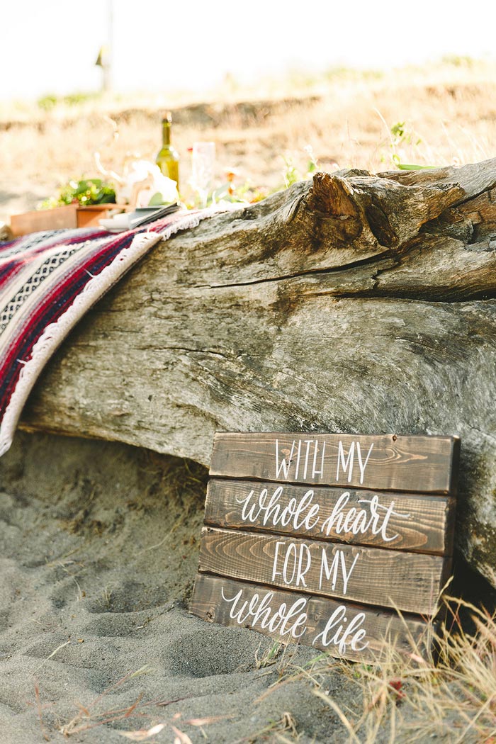 wooden wedding sign on the beach