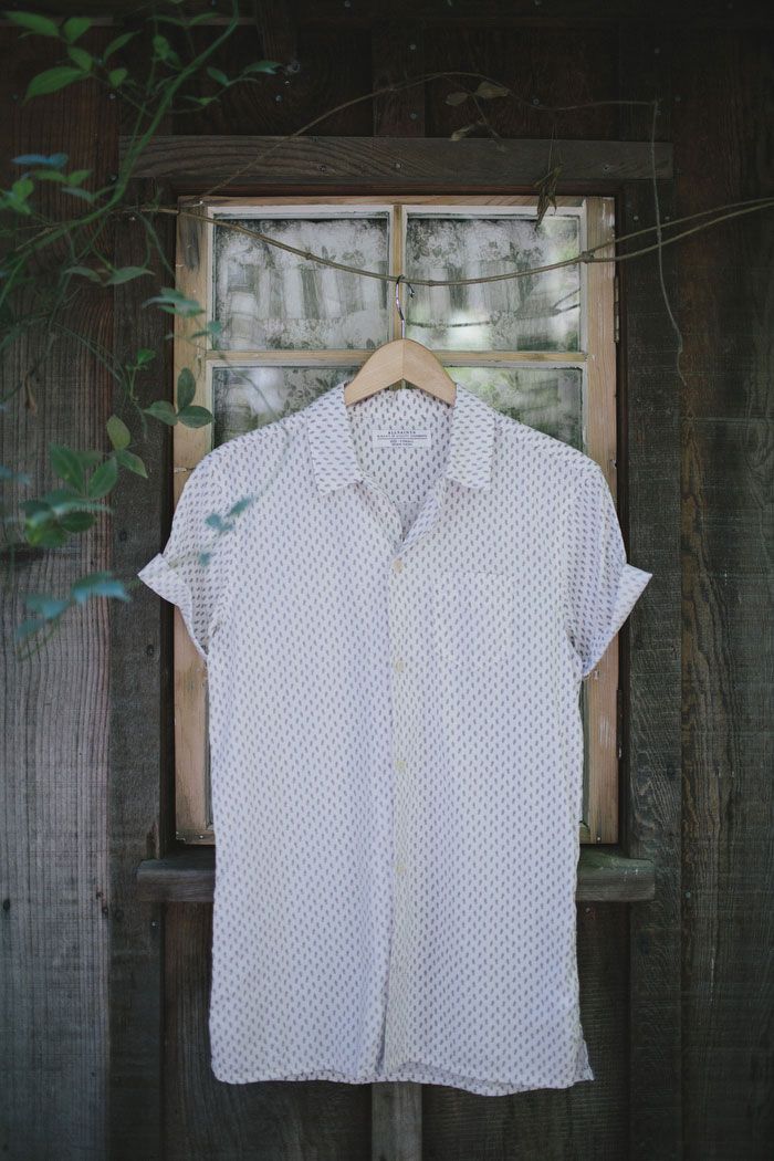 bride's button up shirt hanging up