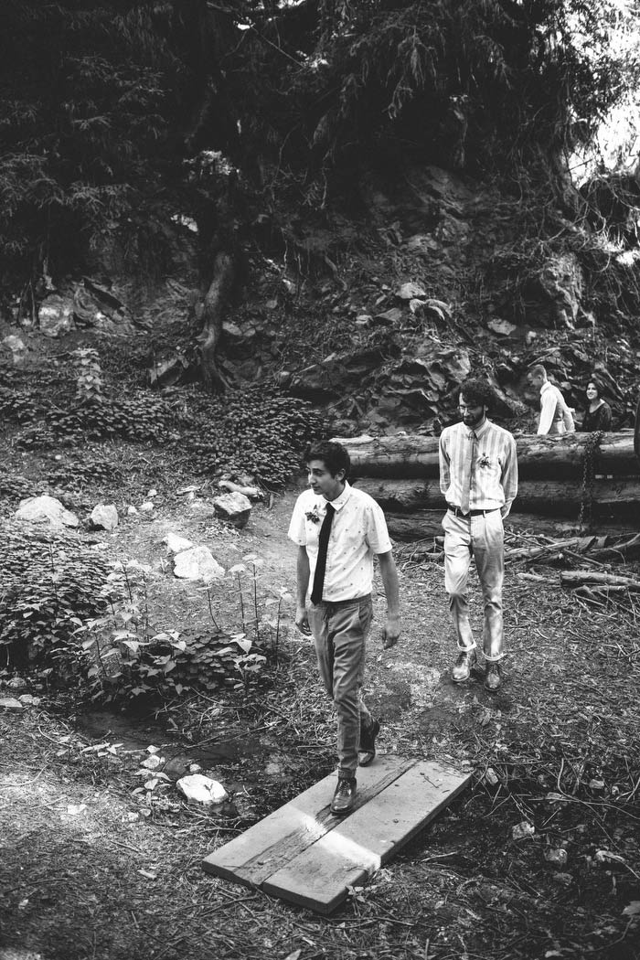 guests walking to ceremony site in the woods