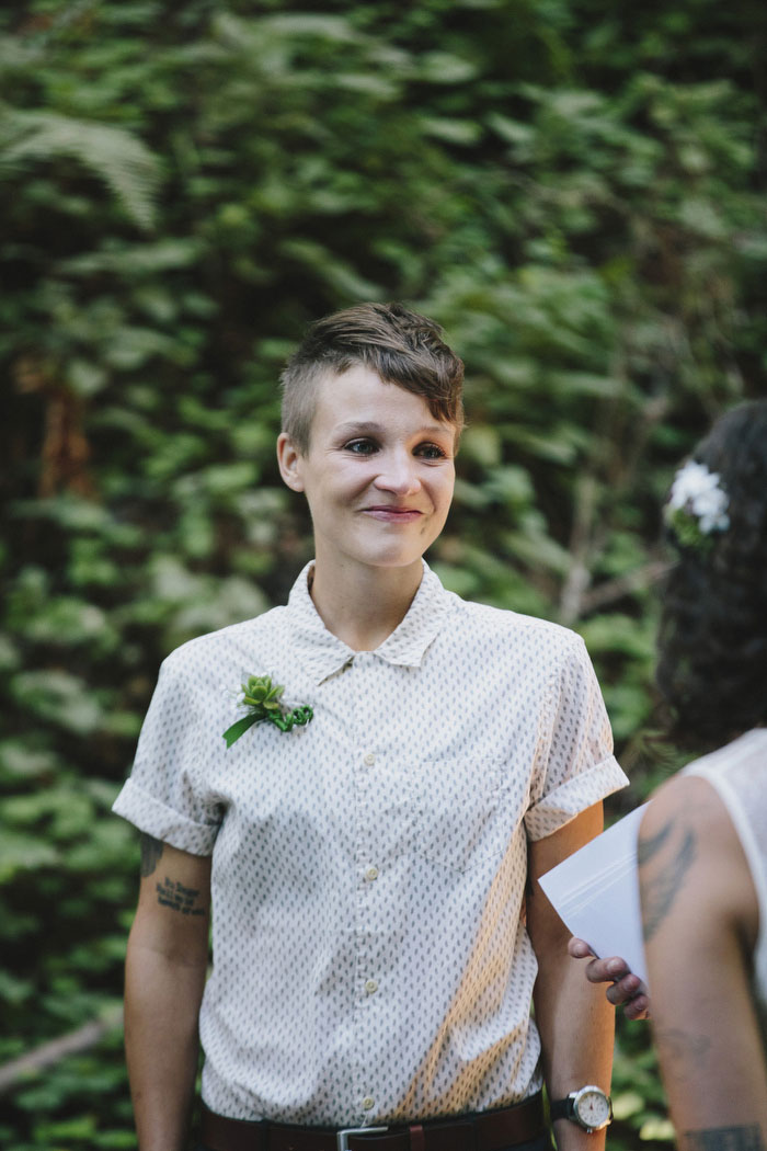 bride smiling at her bride during ceremony 