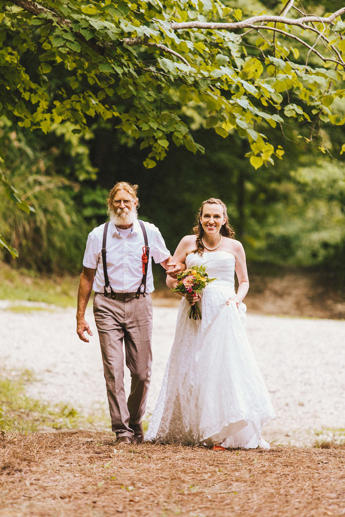 bride walking down the aisle with her father