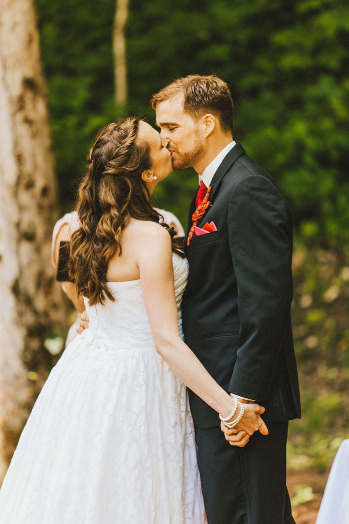 bride and groom first kiss