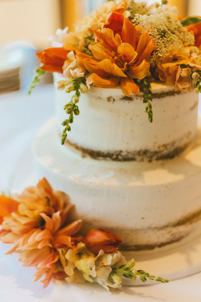 wedding cake with orange flowers