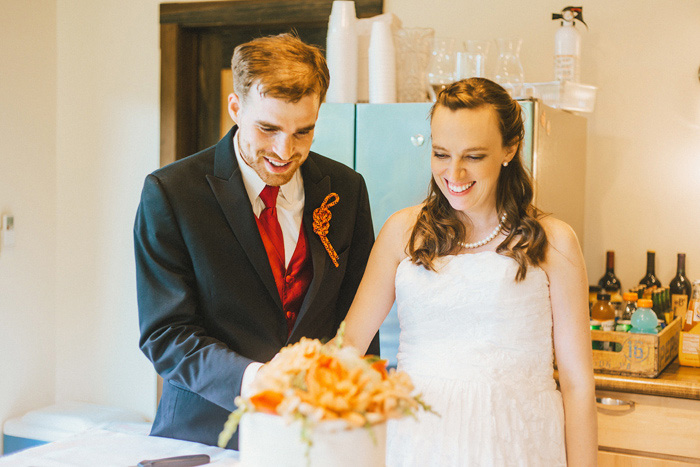 bride and groom cutting cake