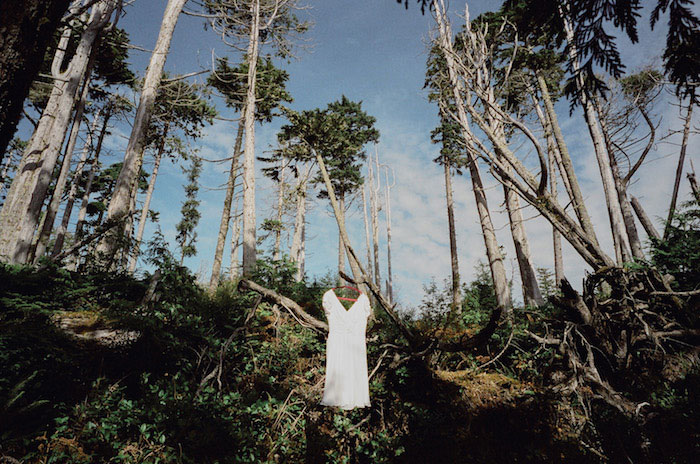 wedding dress hanging in trees