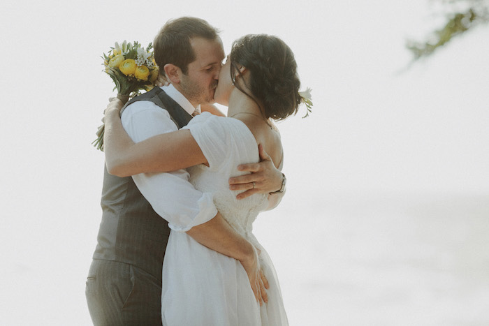 bride and groom first kiss