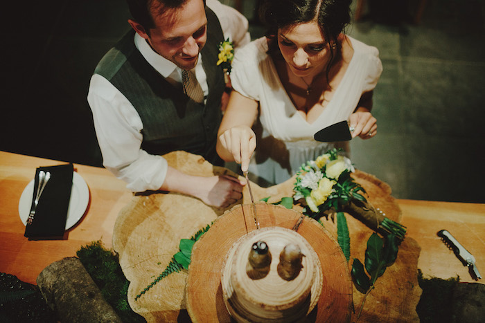 bride and groom cutting cake