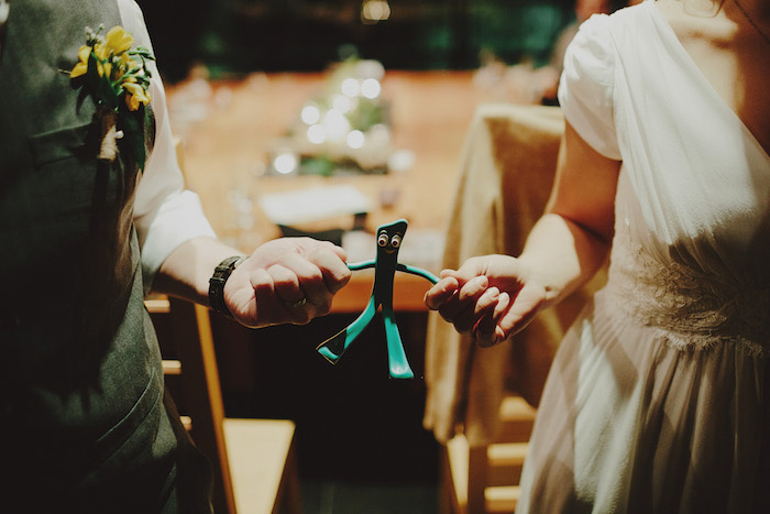 bride and groom holding Gumbi