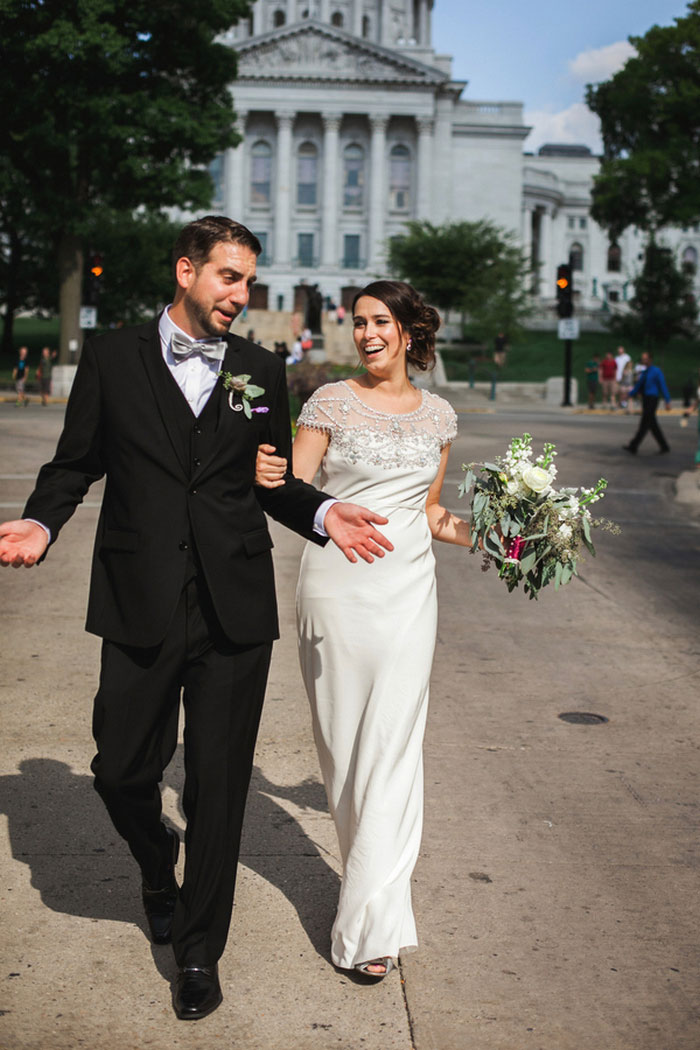 bride and grok walking down the street together