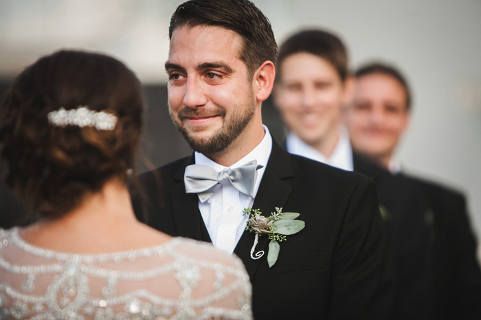 emotional groom at the altar