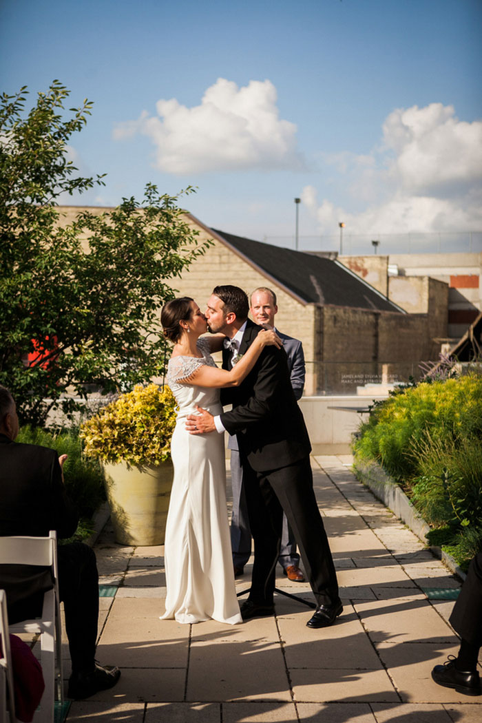 bride and groom first kiss