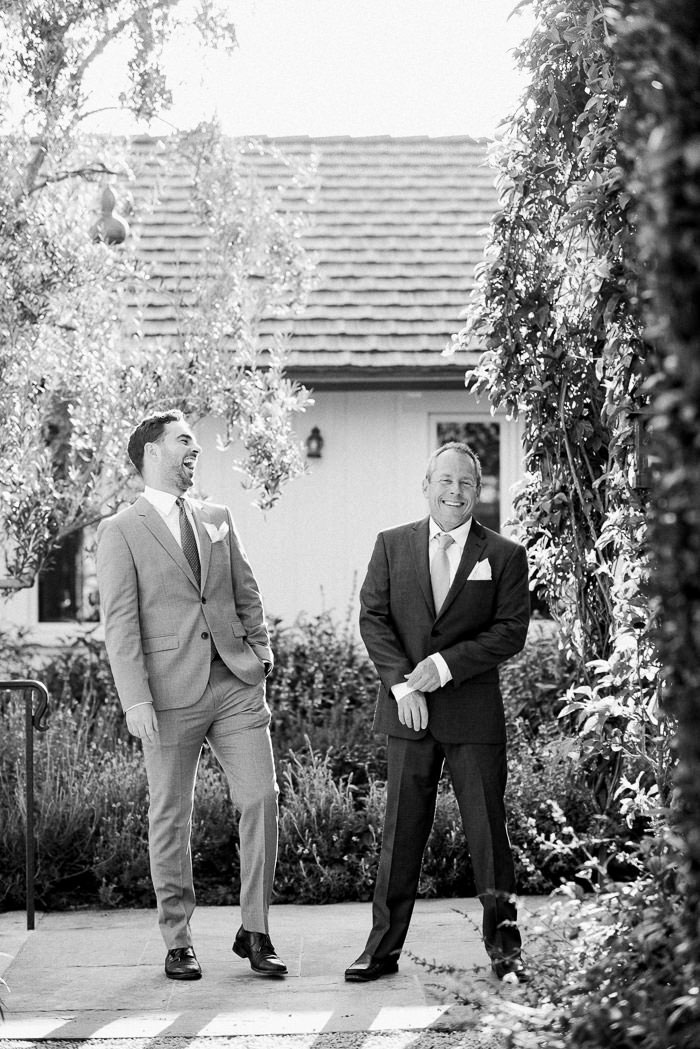 groom laughing with best man