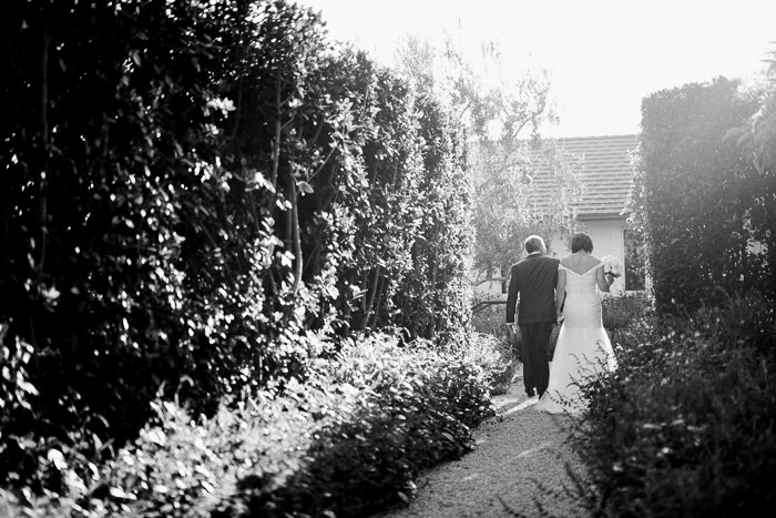 bride and groom walking away