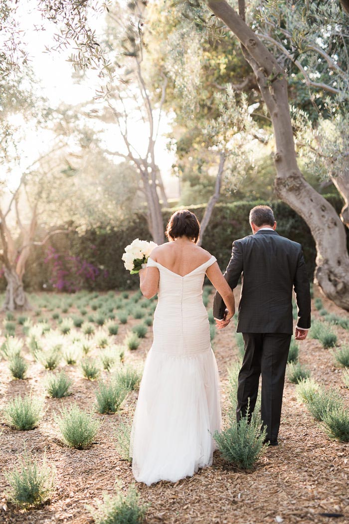 bride and groom walking away