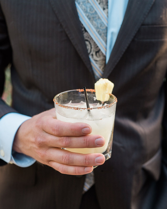 wedding guest holding cocktail